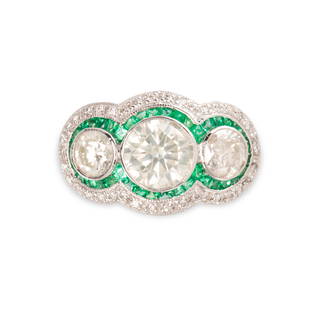 A diamond, emerald and platinum ring: A diamond, emerald and platinum ringdesigned as three round brilliant-cut diamonds, each measuring approximately 0.50, 1.50 or 0.60 carats, framed by calibré-cut emeralds and round brilliant-cut