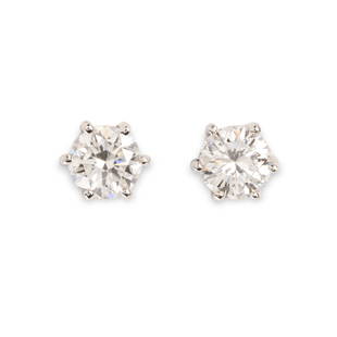 A pair of diamond stud earrings: A pair of diamond stud earringsfeaturing two round brilliant-cut diamonds, weighing 1.01 or 1.02 carats, prong-set in fourteen karat white gold; accompanied by GIA report no. 1216531140, dated 20