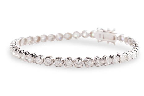 A diamond and fourteen karat white gold bracelet: A diamond and fourteen karat white gold braceletdesigned as a line of round brilliant-cut diamonds; estimated total diamond weight: 5.60 carats. 6.9 dwt; length: 7 in