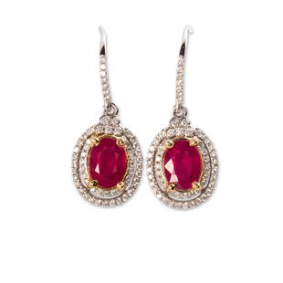 A pair of glass-filled ruby, diamond and fourteen karat: A pair of glass-filled ruby, diamond and fourteen karat white gold earringseach designed as an oval-cut glass-filled ruby, weighing approximately 1.50 carats, framed by round brilliant-cut diamonds.