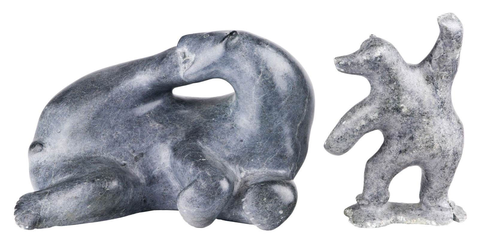 (lot of 2) Inuit figural sculptures, the first (1 of 7)