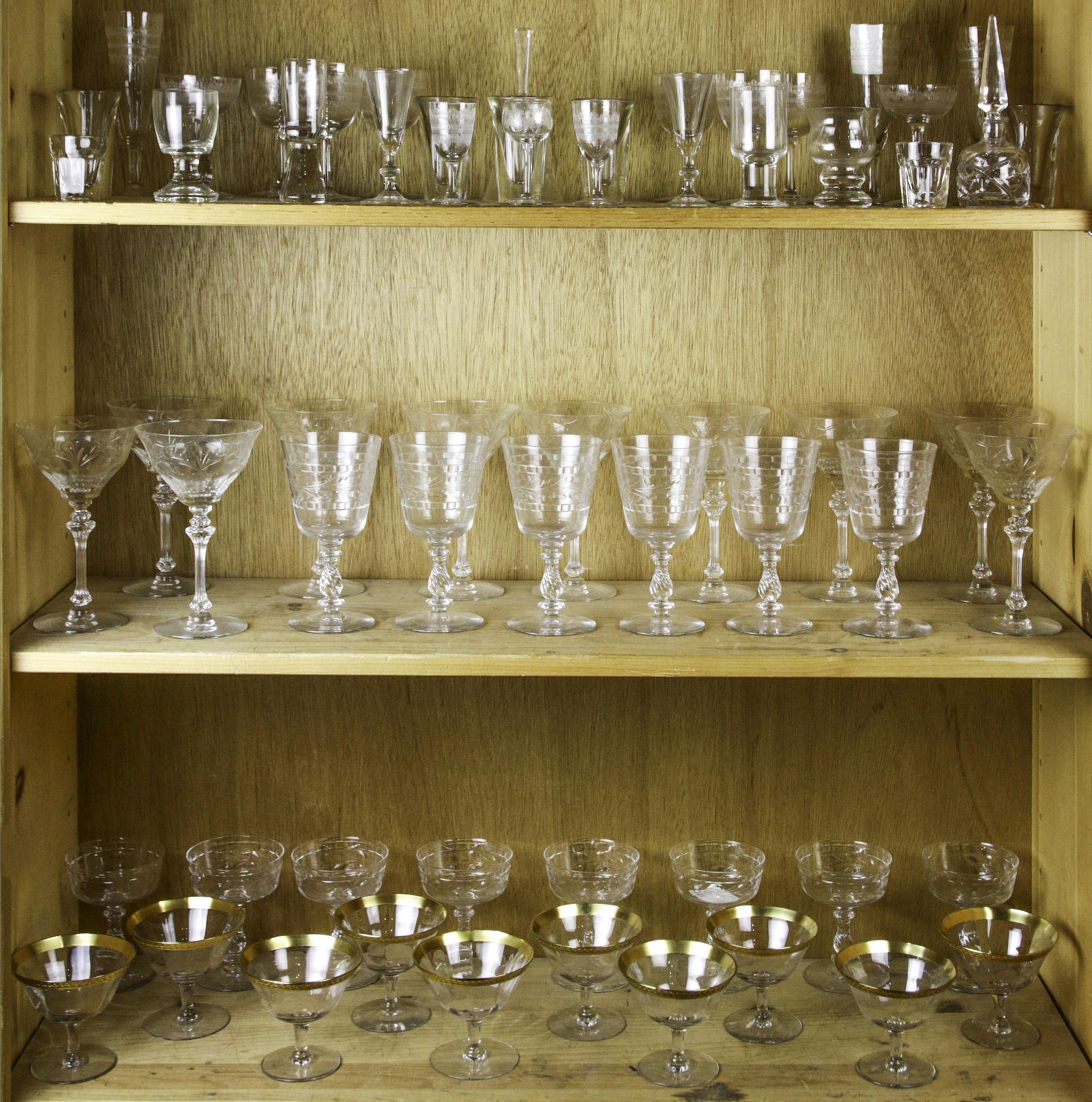 Three shelves of etched glass stemware (1 of 1)