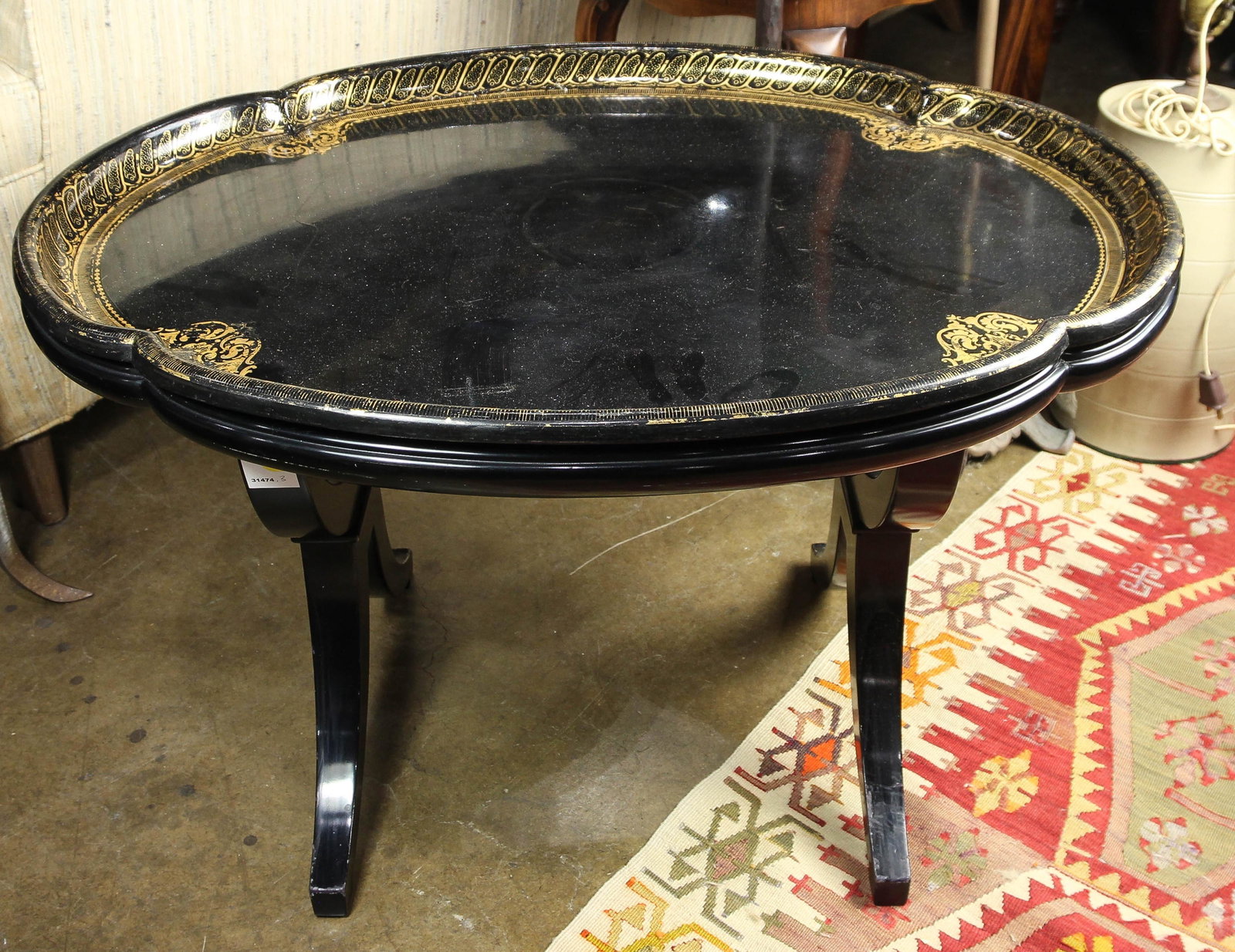 A paper mache table on stand: A paper mache table on stand, 19"h x 30"w x 23.5"d