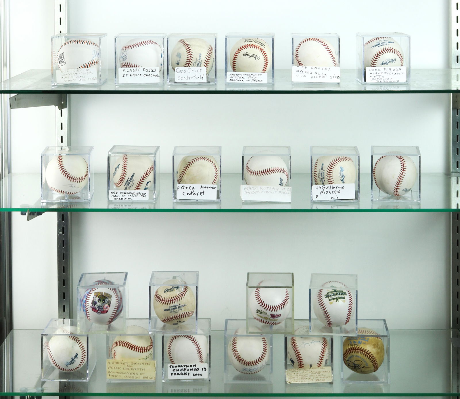 Three shelves of cased and signed baseballs including (1 of 4)