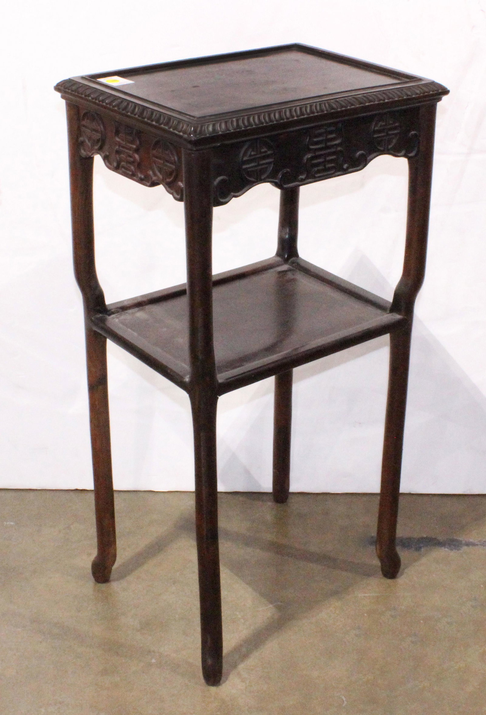 Chinese tiered hardwood stand: Chinese tiered hardwood stand, 33.25"h x 13"w x 17.25"d.