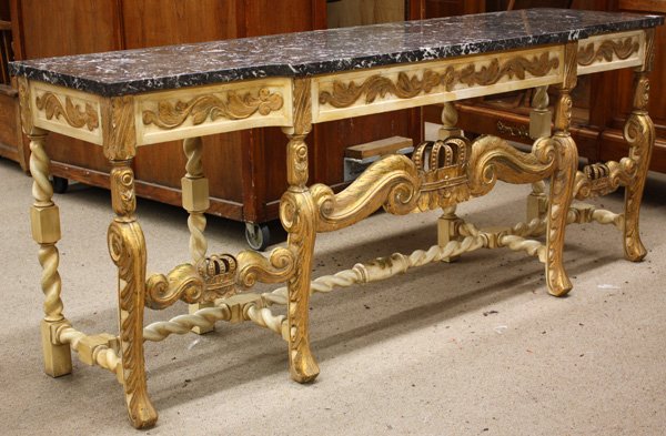 Partial gilt Italian breakfront sideboard: Partial gilt Italian breakfront sideboard, early 20th century with grey variegated marble top over conforming base with center silver drawer, accented floral relief, crown carved front stretchers, ris