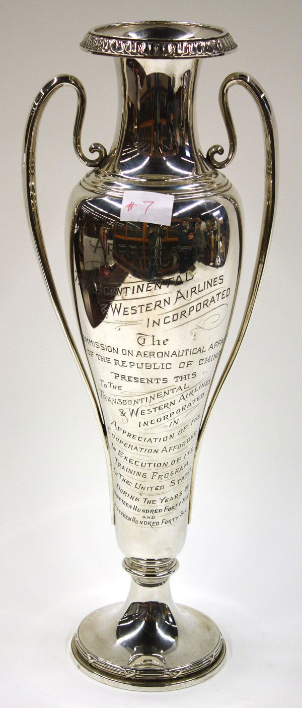 Sterling silver amphora form appreciation trophy: Sterling silver amphora form appreciation trophy, having patterned rim, slightly flaring mouth, scrolling double handles, resting on a circular pedestal base with stepped and gadrooned edge, inscribed