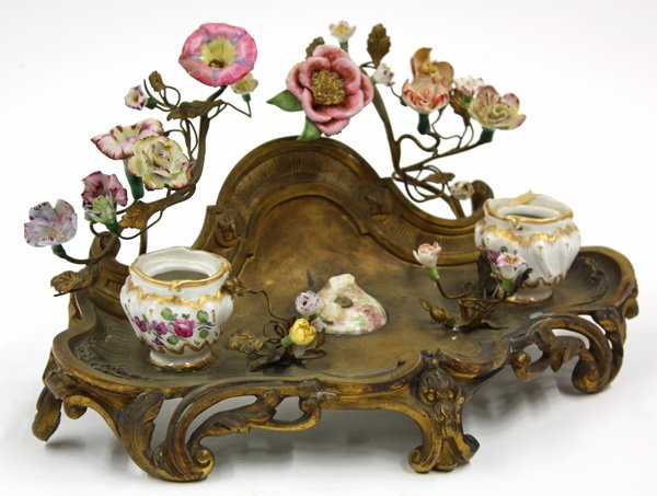 Napoleon III dore double inkwell: Napoleon III dore double inkwell mounted with porcelain flowers, 6.5''h x 12''w x 8''d, damage and losses to porcelain