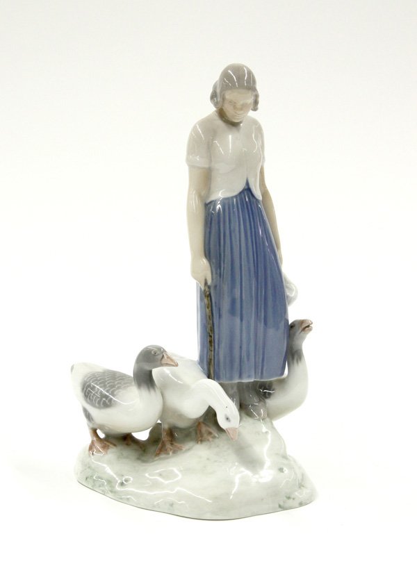 B&G porcelain figures: Bing & Grondahl figural porcelain of a woman with geese marked B & G Denmark and numbered 2254, 9.75''h