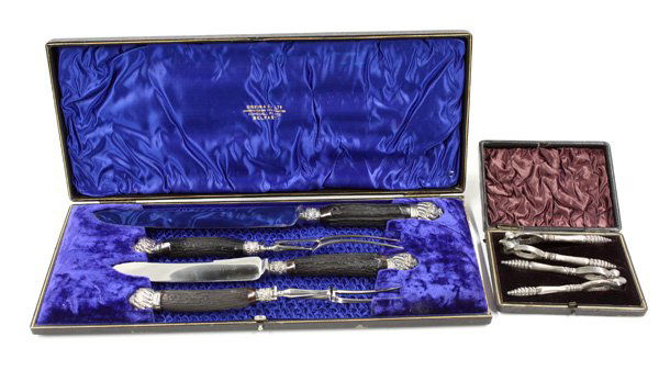 English silverplate nutcrackers, carving set: (lot of 2) One set of English silverplate cased nutcracks c.1850 together with a Gibson and Co. LTD. carving set with horn handles in fitted case