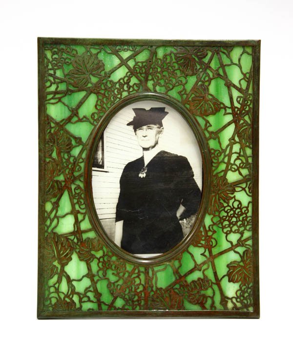 Tiffany Studios Grapevine Picture Frame: Tiffany Studios green glass and bronze picture frame in the Grapevine pattern, impressed Tiffany Studios New York 946 9.5'' x 7.75''