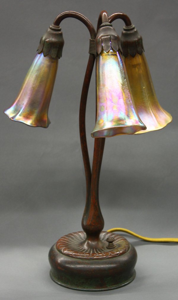 Tiffany Studios 3-light Lily Lamp: Tiffany Studios 3-light Lily Lamp with iridescent signed L.C.T. shades with patinated bronze base stamped: ''28601 Tiffany Studios New York'',13.5''h