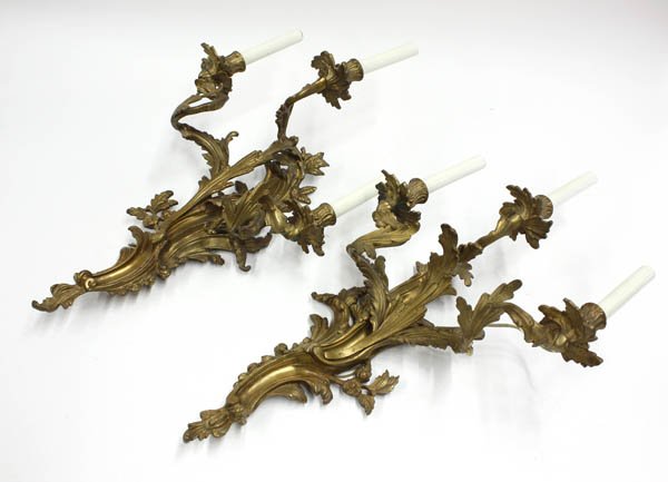 dore Rococo style three light sconces: (lot of 3) Pair of dore Rococo style three light sconces, electrified, 27''h; together with a single five light sconce of similar fashion, 28''h