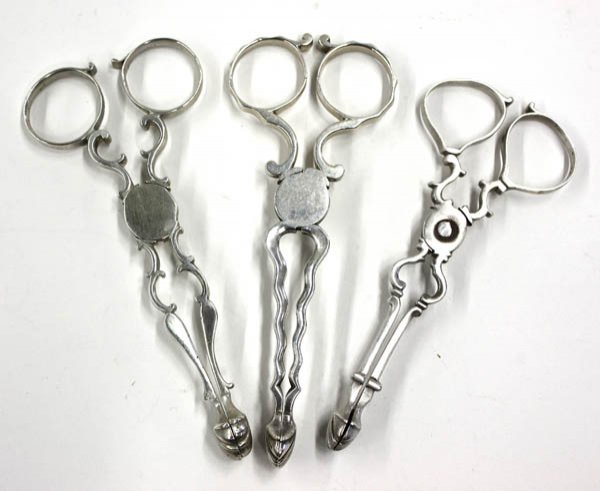 antique sterling silver sugar tongs: (lot of 3) Selection of antique sterling silver sugar tongs including two pairs possibly by Henry Plumpton (London, circa 1761) and one pair possibly by Richard Mills (London, circa 1764), 3.4 troy oz