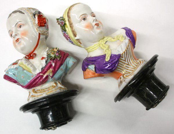 German polychrome decorated porcelain busts: Pair of German polychrome decorated porcelain busts with cross hatch blue maker's mark, 6''h mounted to marble pedestals, repairs to pedestals, overall height 16''