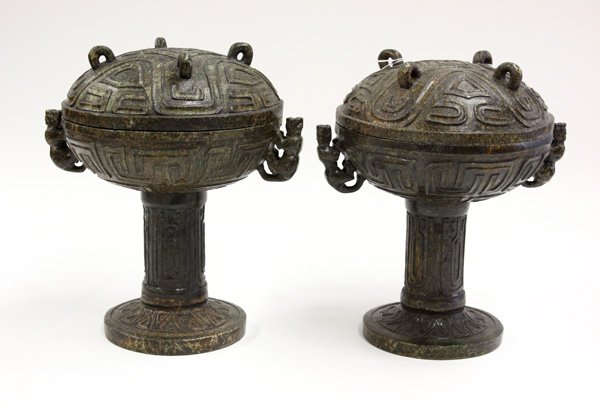 Chinese Archaistic Stone Vessel: (lot of 2) Chinese archaistic stone vessels, in the shape of a dou food vessel with a dome-form top with archaistic patterns framing four lug handles/supports and repeated on the sides of the lower bo