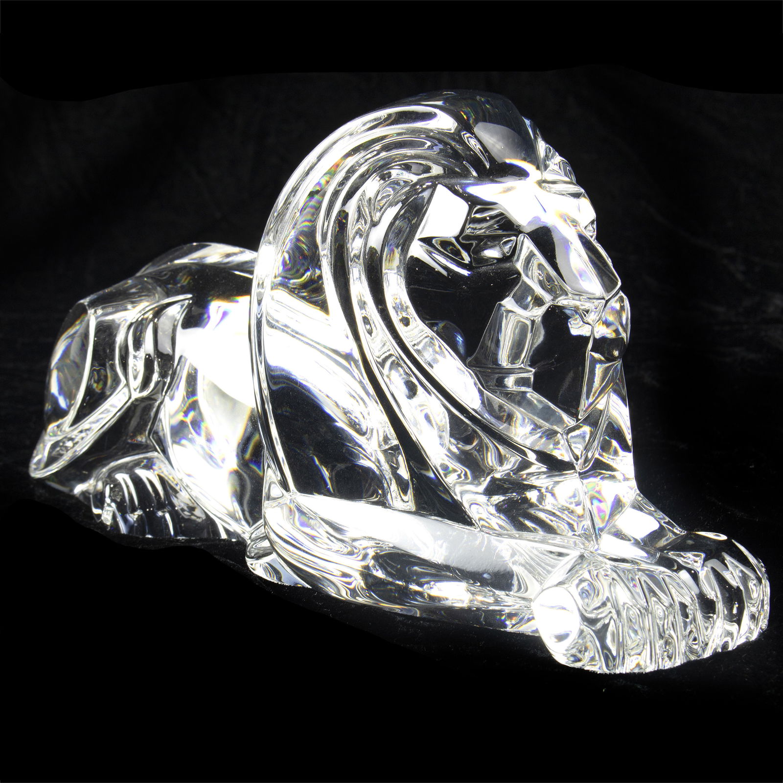 A Steuben figural sculpture of a recumbent lion, (1 of 3)