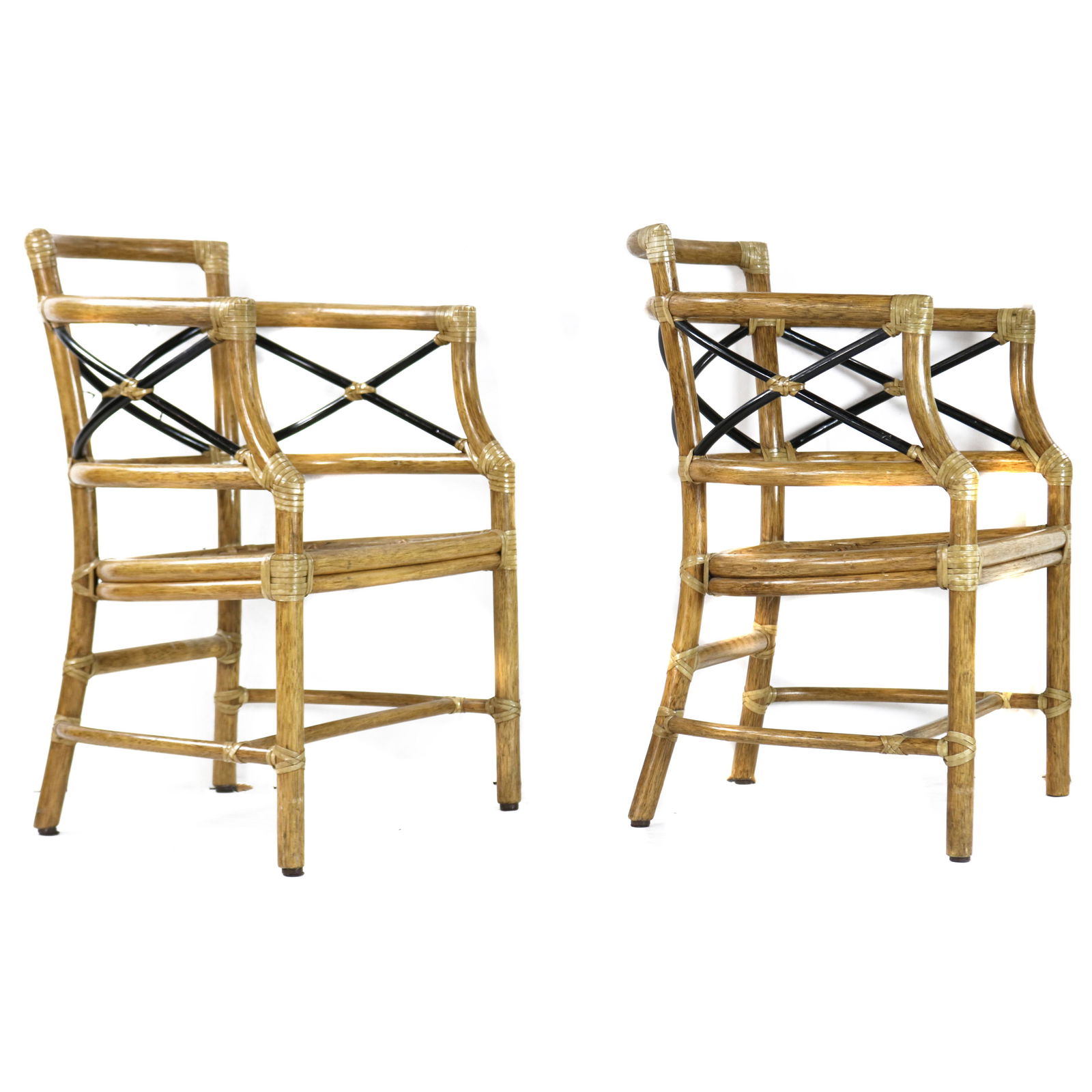 A pair of McGuire partial ebonized armchairs (1 of 3)