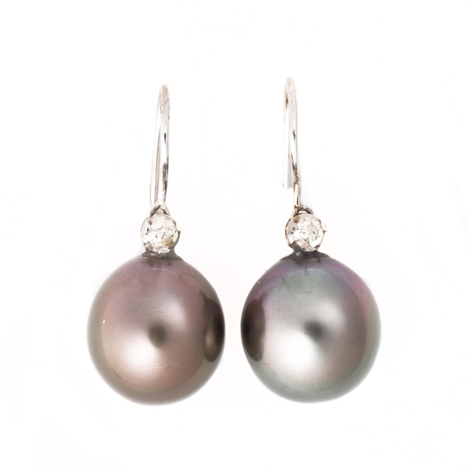 A pair of Tahitian South Sea pearl, diamond and: A pair of Tahitian South Sea pearl, diamond and fourteen karat white gold earrings each a saltwater cultured pearl, measuring approximately 12.80 mm in diameter, surmounted by a round brilliant-cut di