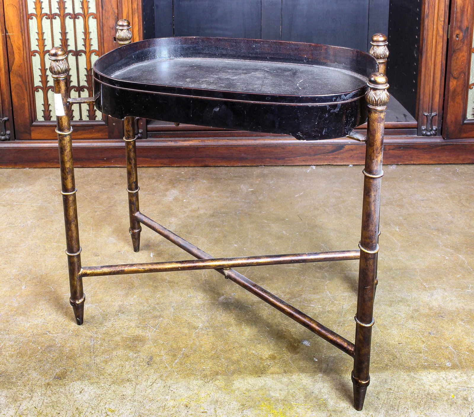 An ebonized tray on later stand: An ebonized tray on later stand, 24"h x 22"w x 13"d