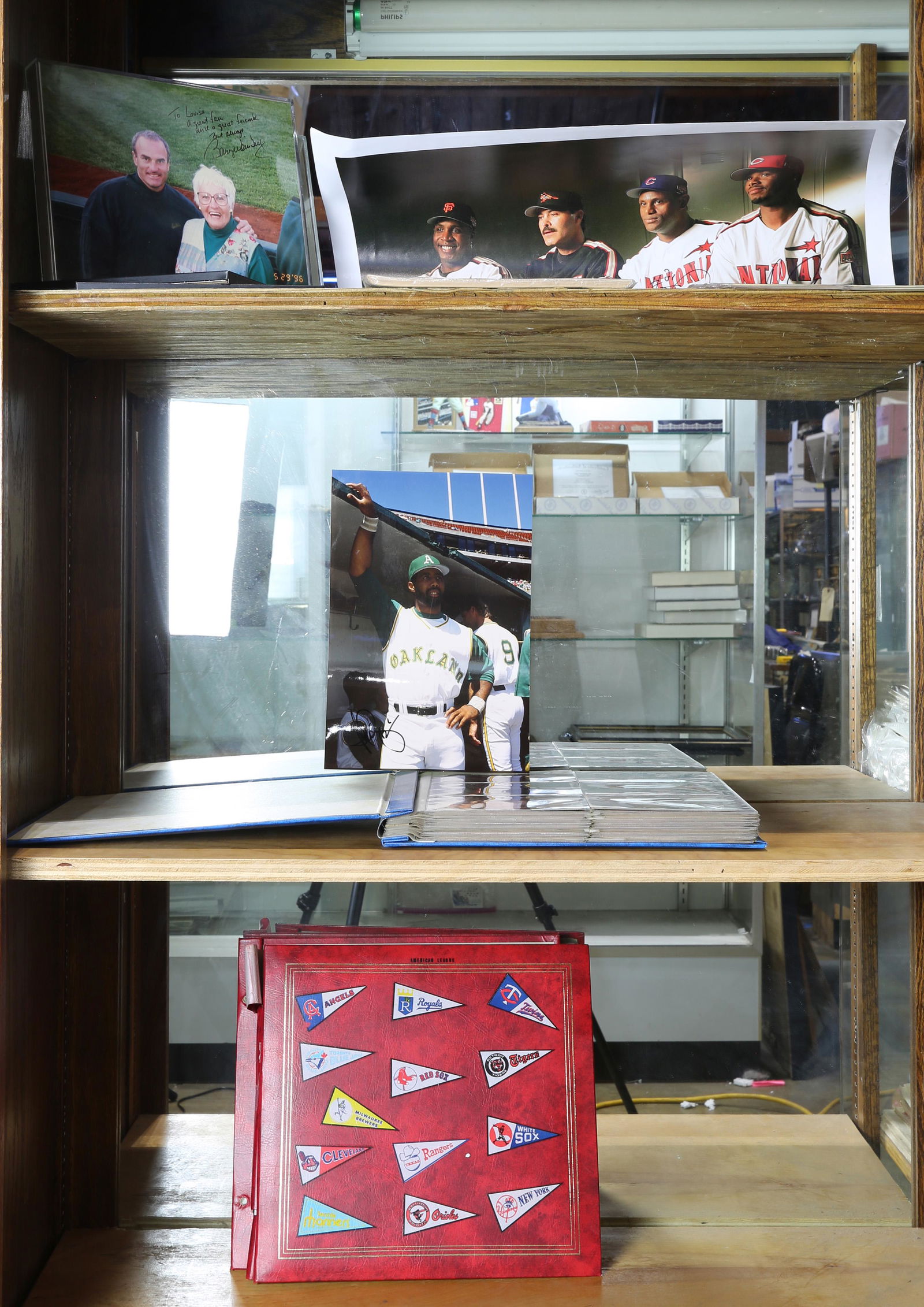 Three shelves of baseball photographs including some (1 of 1)