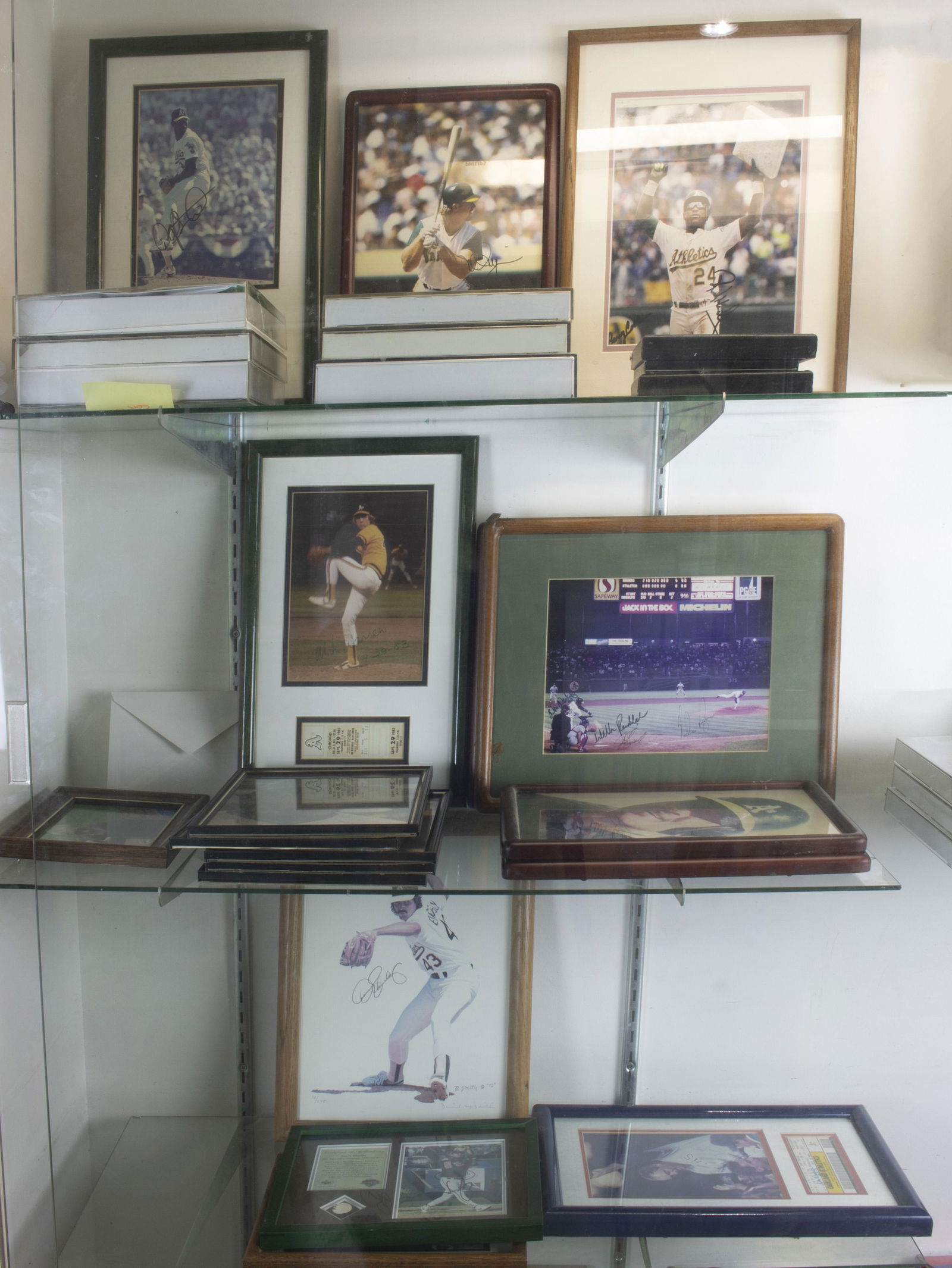 Three shelves of mostly baseball photographs (1 of 1)
