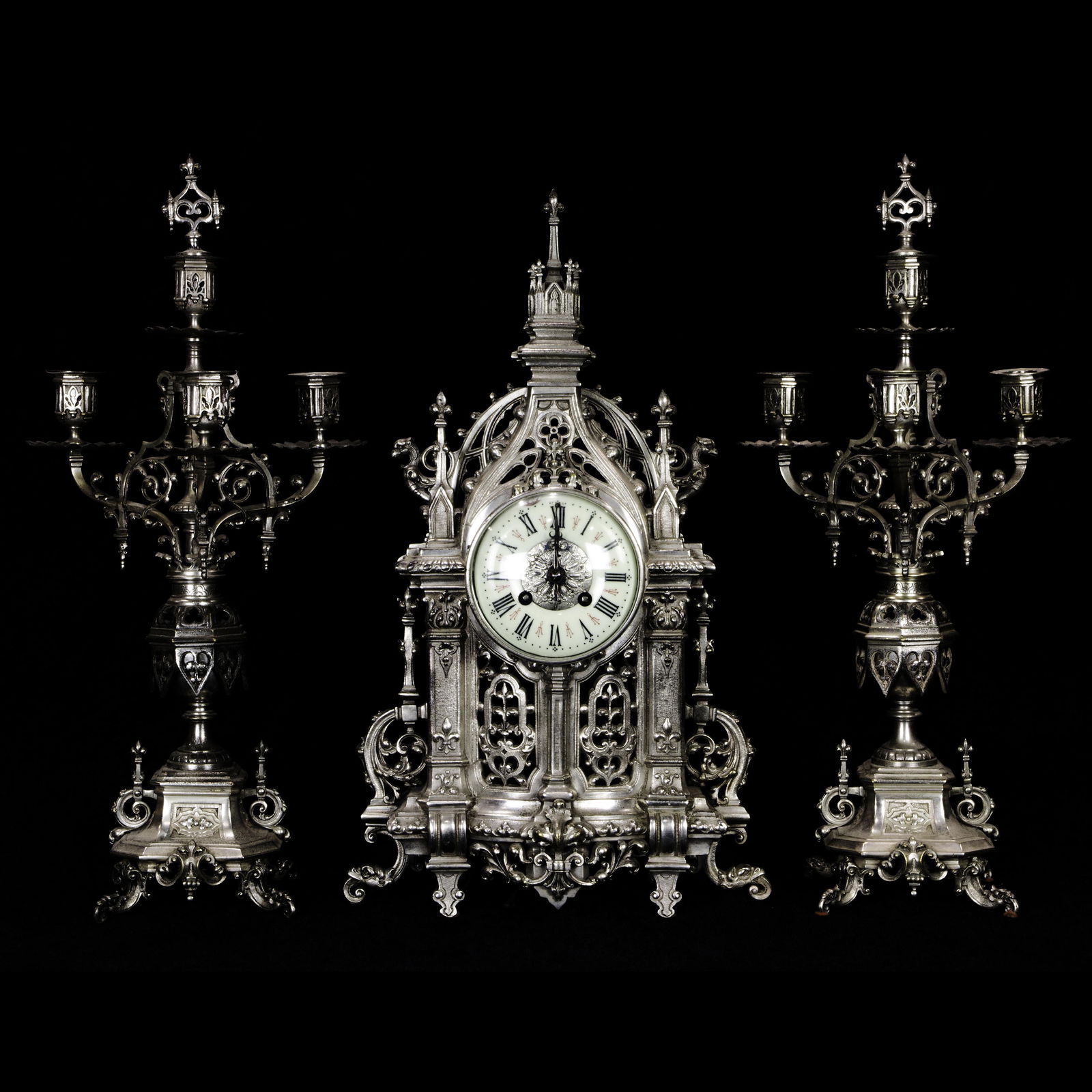 A (lot of 3) French silver metal clock with garniture, (1 of 6)