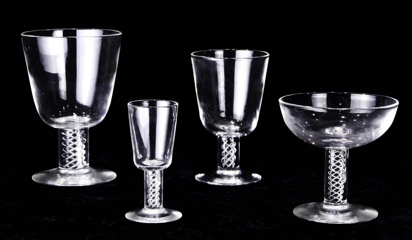 Collection of Steuben glass air twist stemware: Collection of Steuben glass air twist stemware, comprising (8) champagne coupes, (8) water goblets, (7) wine goblets and (8) cordials. Tallest is water goblet 5 1/2"h