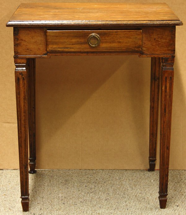 French Directoire style single drawer work table: French Directoire style single drawer work table, the ogee edge top above a single drawer case having a stepped apron and raised on squared, fluted legs 28.5''h x 25''w x 20''d