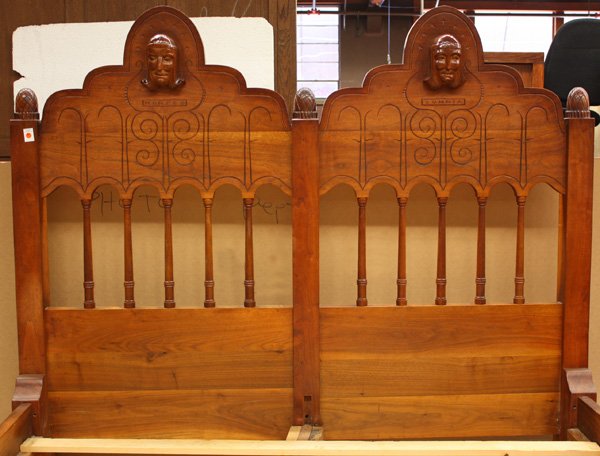 Solid Cuban mahogany bed: Solid Cuban mahogany bed circa 1935, the arched stepped crest having pineapple finials flanking figural carvings of Morfeo and Somnia, the mythological gods of dreams, above incised decoration and ful