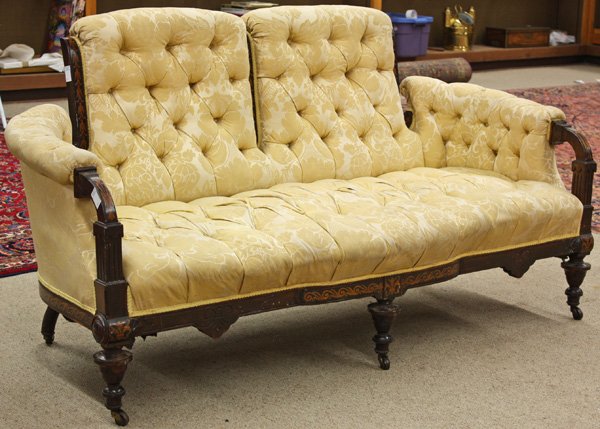 American Aesthetic inlaid settee: American Aesthetic rosewood, marquetry and partial ebonized settee, attributed to Herter Brothers New York circa 1880, the tufted back framed by conjoined foliate inlay, the arms with floral panels te