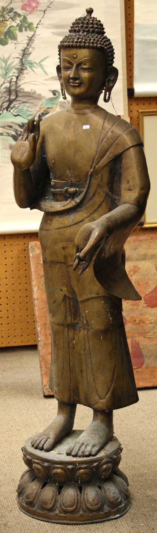 South Asian Large Metal Buddha Figure: South Asian/Nepalese large copper-alloy figure of the Buddha, standing in monastic robes on a reticulated double lotus pedestal, his hands in the gestures of reassurance and gift-giving (abhaya and va