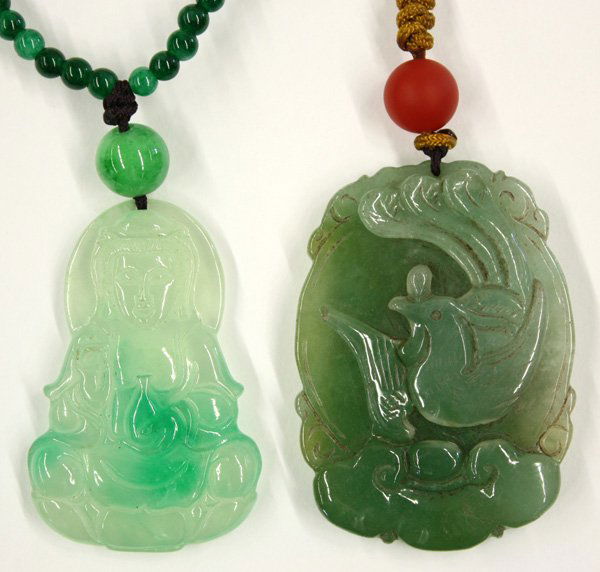 Jade/Jadeite Chinese Pendants, Guanyin, Dragon: (lot of 2) Chinese carved jade/jadeite pendants, the first shaped with Guanyin seated on a lotus pedestal with an amphora, the translucent pale green matrix mottled by bright green splashes; the other