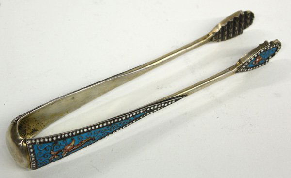 Russian enamelled silver sugar tongs: Russian enamelled silver sugar tongs, embellished with floral designs on a robin's egg blue background, Moscow, the Cyrillic maker's mark translated to 'VA', dating to between 1898 and 1908, 5.5''l