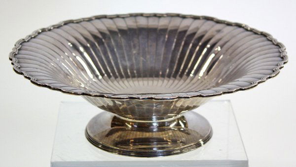Birmingham sterling silver footed bowl: Birmingham sterling silver footed bowl by Mappin & Webb, having stylized border and radially chased sides, dating to 1927, 12 troy oz. (minor dents)