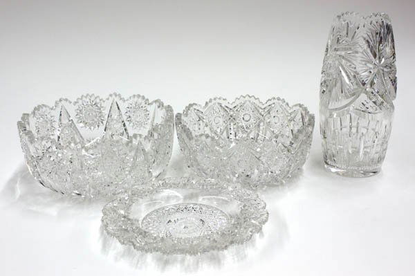American cut crystal bowls, vase, and coaster: (lot of 4) American cut crystal bowls, vase, and coaster having sawtooth rims, and various hobstar, pinwheel, and diamond patterns