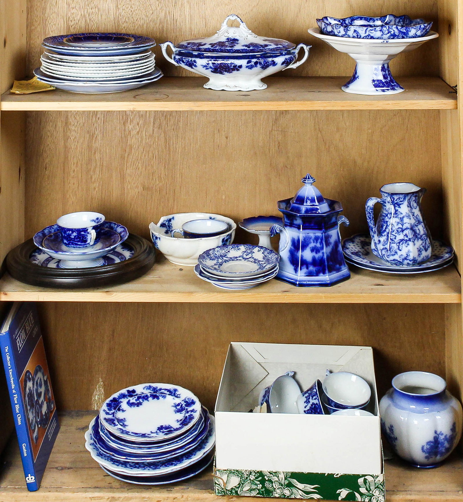 Four shelves of flow blue tableware including plates (1 of 1)