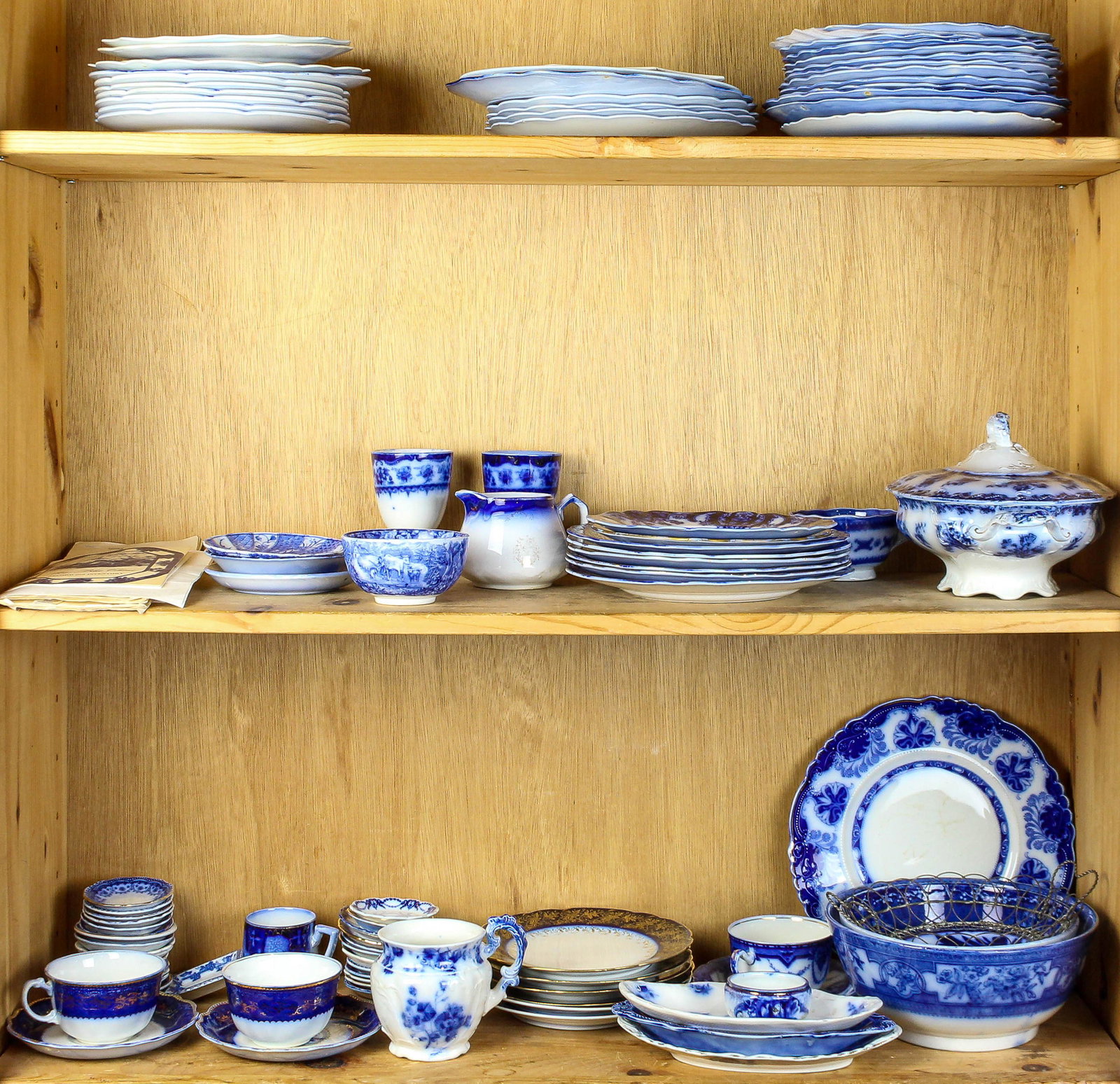 Three shelves of mostly English flow blue tableware (1 of 1)