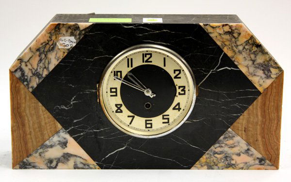 Art Deco marble mantle clock: Art Deco marble mantle clock, the case executed in various colors with an unsigned face having deco style numerals, circa 1930, lacking cover 10''h x 17''w x 4''d