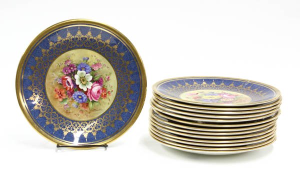 Royal Worcester dinner plates: Set of 14 Royal Worcester dinner plates, 9.5''w, with cameo of wild flowers signed by artist Ernest Barker, unused and purchased in 1935-accompanied by a copy of a letter and article from Royal Worces