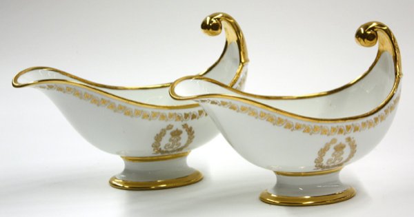 Sevres porcelain urn form gravy boats: Pair of Sevres porcelain urn form gravy boats having a scroll handle, trimmed with gilt ivy border and adorned with central ''L'' monogram and classical olive branch wreath, stamped with green mark, 7