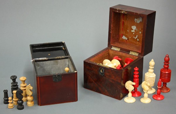English flame mahogany tea caddy: (lot of 2) English flame mahogany tea caddy, lacking mounts and housing a partial bone chess set, 5.5''h x 5''w x 5''d, with a Japanese lacquered tea caddy having a metal lined interior, housing parti