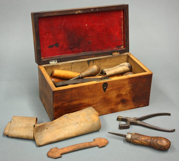 English mahogany box: English mahogany box having string inlay, housing a collection of nineteenth century woodworking tools, 6''h x 13''w x 6.5''d