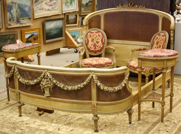 Louis XVI style polychrome bedroom set,: Five piece Louis XVI style polychrome bedroom set, the bed with a floral carved crest above the inset wicker panels, the footboard with carved floral swags of garland 51''h x 63''w x 90''l, the two be