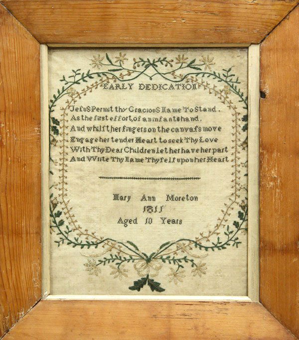 Framed needlework sampler: Framed needlework sampler by Mary Ann Moreton dated 1811, with a floral and vine border and biblical verse, 20.5''l x 18''w (some staining and loses throughout)