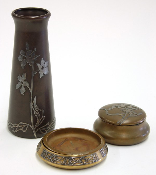 Heintz sterling on bronze art metal articles: (lot of 3) Heintz sterling on bronze art metal articles including a vase 7''h, a covered box 2''h, and a coaster with insert 4.5''d, all with sterling floral and geometric patterns
