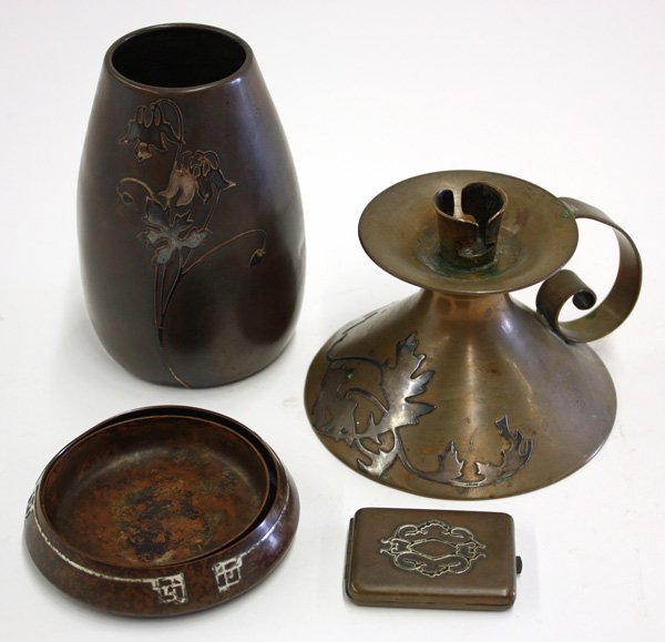 Heintz sterling on bronze art metal articles: (lot of 4) Heintz sterling on bronze art metal articles including a bulbous vase 5''h, a handled candle holder 3''h, a pill box 2.5''w, and a tray with insert 4'', all with floral and geometric patter