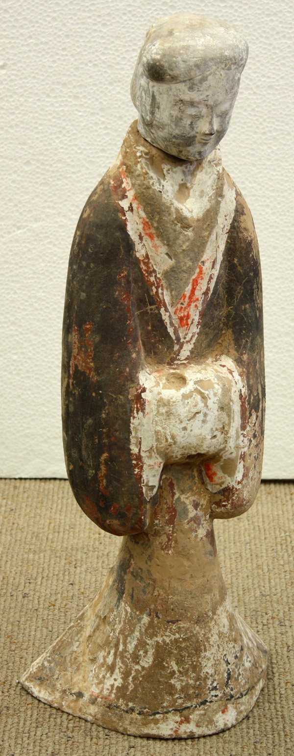 Chinese ceramic tomb figure, Han: Chinese large two section polychrome painted ceramic tomb figure, Han dynasty, fashioned as a female attendant clothed in long robes flaring at the hem and with her hands held to the front, with origi