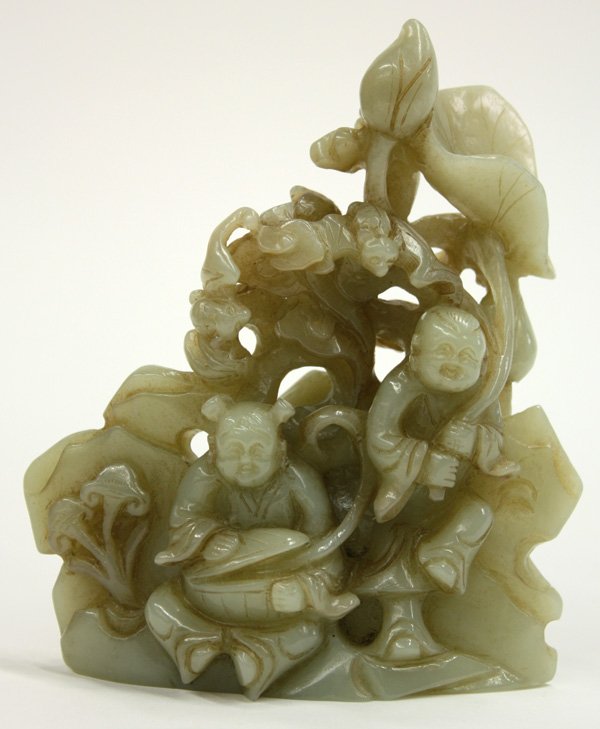 Chinese Jade Carving, Children: Chinese jade figural group, carved and undercut two joyous children framed by ruyi sprigs, large lotus leaf and bud, along with a pair of bats all in front of rock work, with details further repeated 