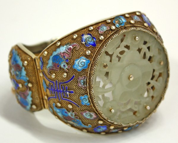Chinese Gilt Metal, Jade, Enamel Bracelet: Chinese gilt metal filigree bracelet, fronted by a circular jade plaque pierced with prunus blossoms set into a gilt metal filigree three-part setting embellished with raised shou characters, bats and